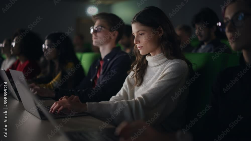 Beautiful Smart Female Student Studying in University with Diverse Multiethnic Classmates. She is Using a Laptop Computer. Applying Her Knowledge to Acquire Academic Skills in Class Beautiful Smart Female Student Studying in University with Diverse Multiethnic Classmates. She is Using a Laptop Computer. Applying Her Knowledge to Acquire Academic Skills in Class