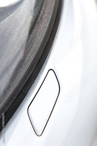 Lviv, Ukraine - May 19, 2018. A Close-Up of a White Porsche Panamera Headlight Washer