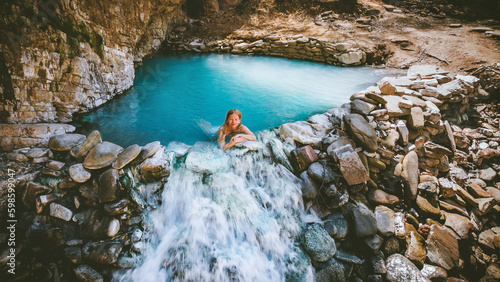 Woman bathing in a hot spring outdoor travel in Albania, Benja thermal bath girl relaxing in natural pool summer vacations healthy lifestyle