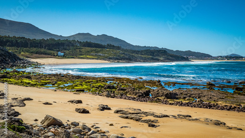 Porto do Son, Galicia, Spain - April 6, 2023: Beach in Castro de Baroña photo