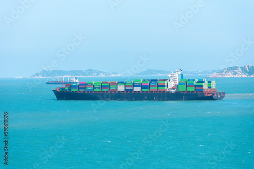 Cargo container ship anchored near Chinese sea coast.