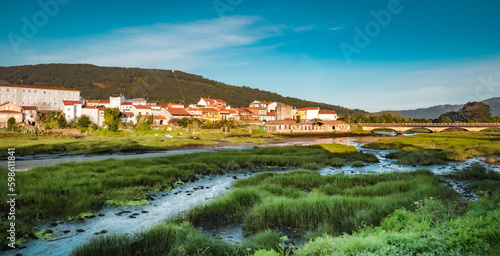 Noia, Galicia, Spain - April 4, 2023: General view of the town and River Vilacoba photo