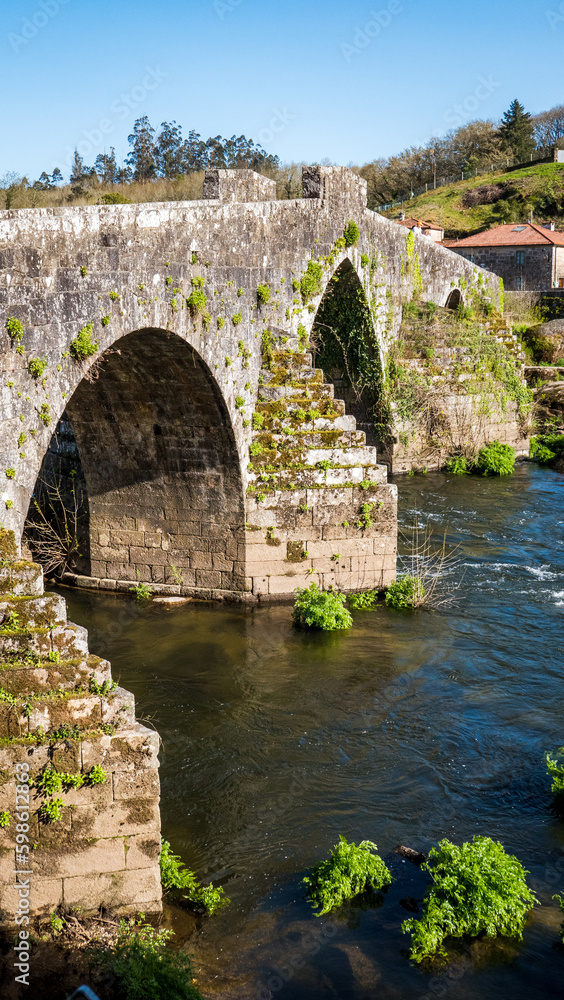 A Ponte Maceira, Galicia, Spain - April 4, 2023: Roman stone bridge over the River Tambre