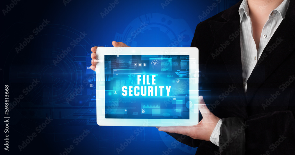Person holding tablet, security concept Person holding tablet, security concept