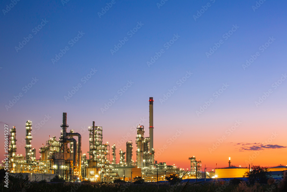 Twilight scene of tank oil refinery plant and tower column of Petrochemistry