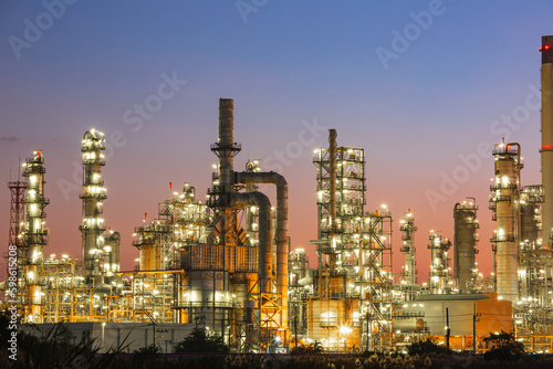 Twilight scene of tank oil refinery plant and tower column of Petrochemistry