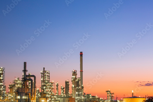 Twilight scene of tank oil refinery plant and tower column of Petrochemistry