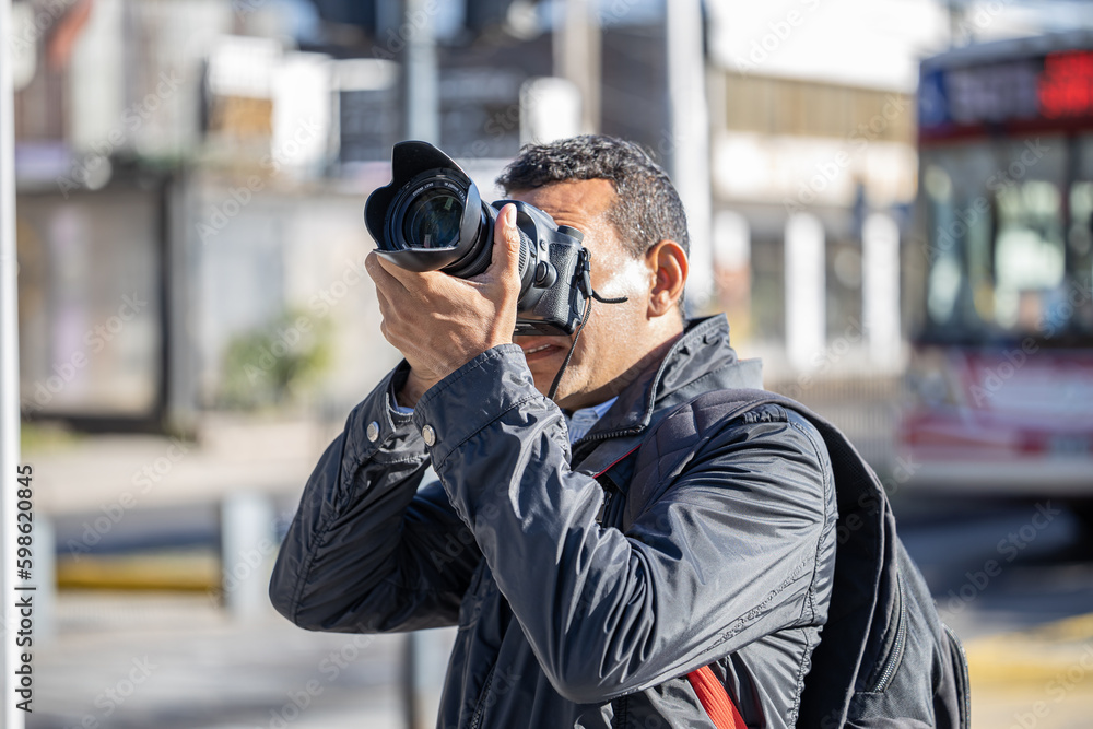 Close-up of a photographer taking a picture. Close-up of a photographer taking a picture.