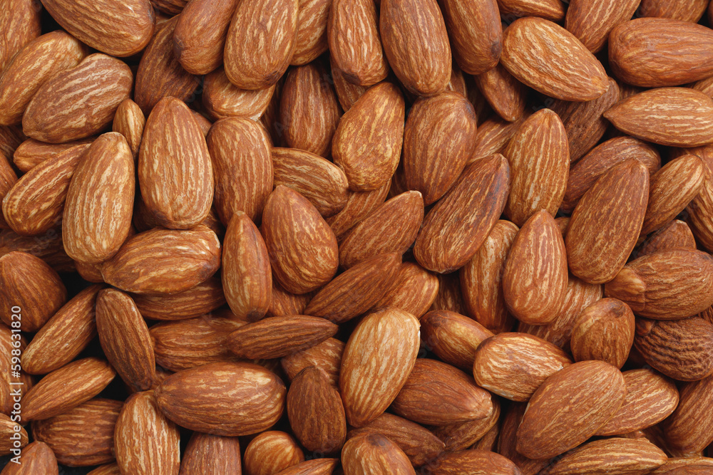 Pattern Organic almond nut raw peeled as background, top view. Healthy snack or for vegetarians. copy space banner. Pattern Organic almond nut raw peeled as background, top view. Healthy snack or for vegetarians. copy space banner.