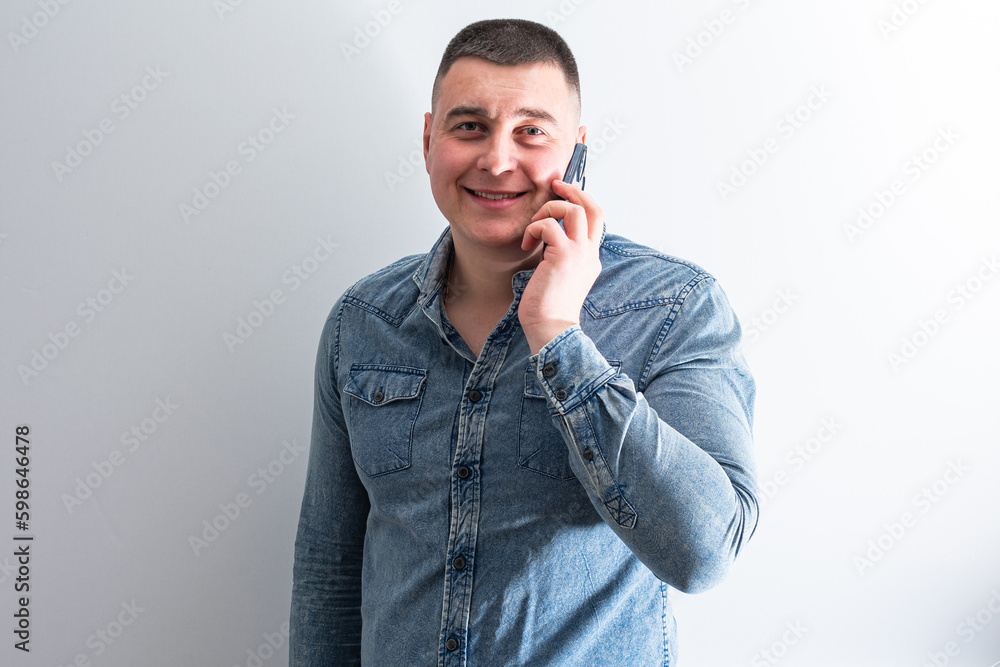 A man is talking on the phone A man is talking on the phone