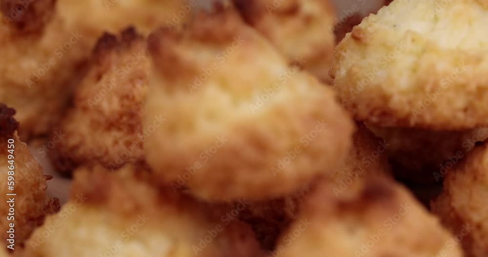 focus on a small homemade coconut cookies made using coconut chips, homemade cookies close up focus on a small homemade coconut cookies made using coconut chips, homemade cookies close up