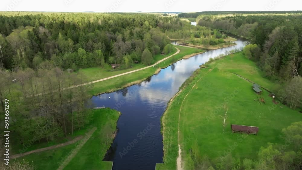 flying over forest and wide river on a sunny day flying over forest and wide river on a sunny day