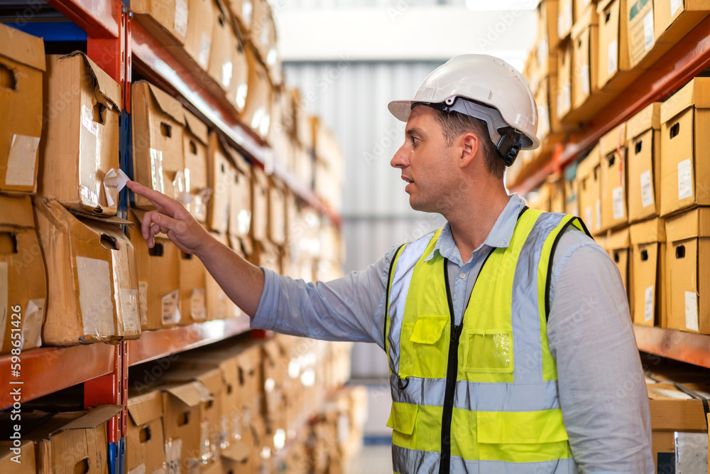 Portrait engineer labor man shipping transportation ship loading move inventory cardboard boxes in factory distributions warehouse at logistics center.logistic industry and business import export Portrait engineer labor man shipping transportation ship loading move inventory cardboard boxes in factory distributions warehouse at logistics center.logistic industry and business import export