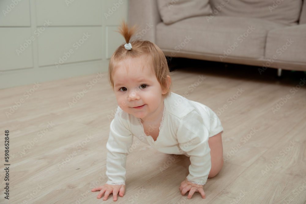 baby girl crawling on the floor at home baby girl crawling on the floor at home