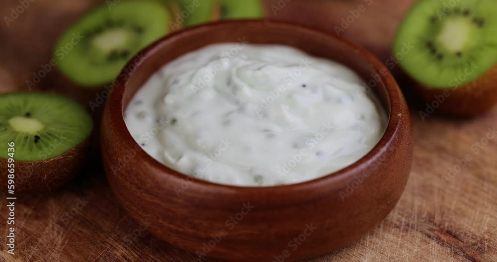 fresh yogurt made from natural ingredients with kiwi, milk fresh yogurt with kiwi flavor and kiwi slices fresh yogurt made from natural ingredients with kiwi, milk fresh yogurt with kiwi flavor and kiwi slices