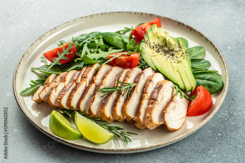 Grilled chicken or turkey breast with fresh vegetable salad. Detox and healthy superfoods bowl concept