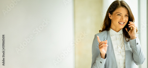 Young woman with mobile pho...