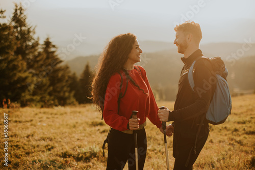 Smiling couple walking with...