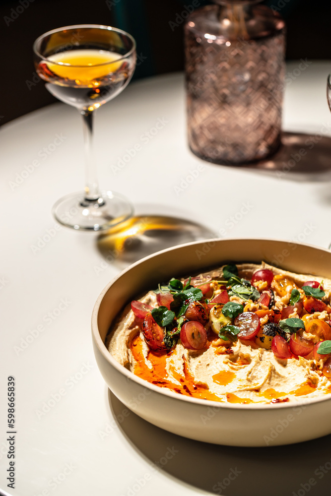 hummus and vegetables salad. Restaurant menu, dieting, cookbook recipe top view hummus and vegetables salad. Restaurant menu, dieting, cookbook recipe top view