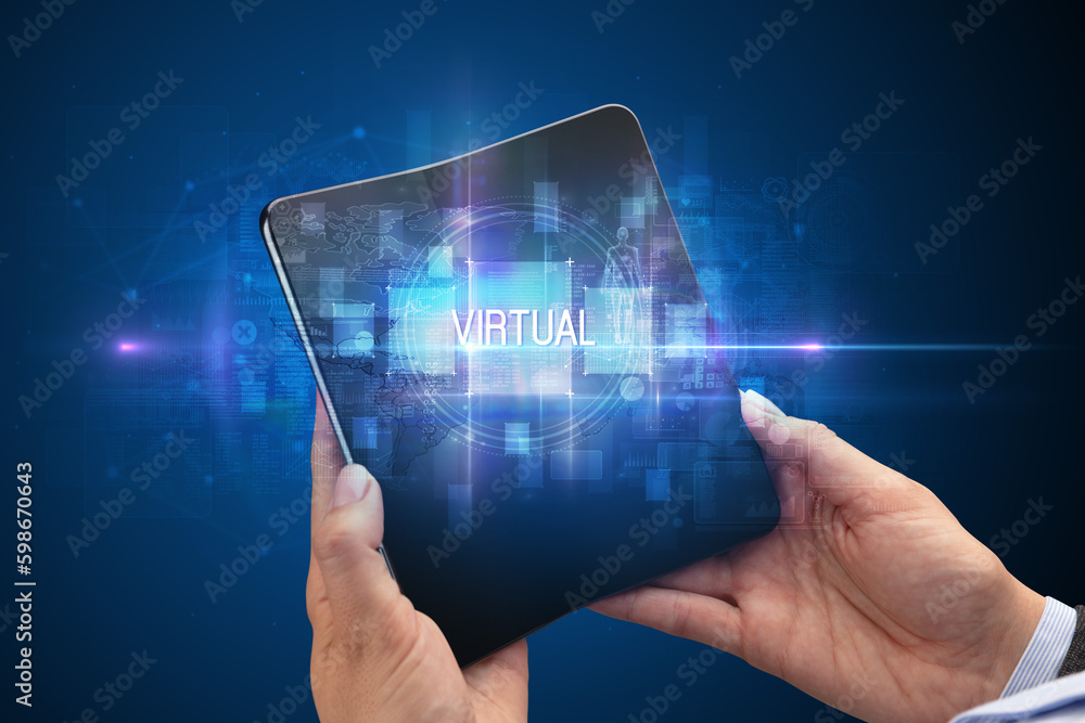 Businessman holding a foldable smartphone Businessman holding a foldable smartphone