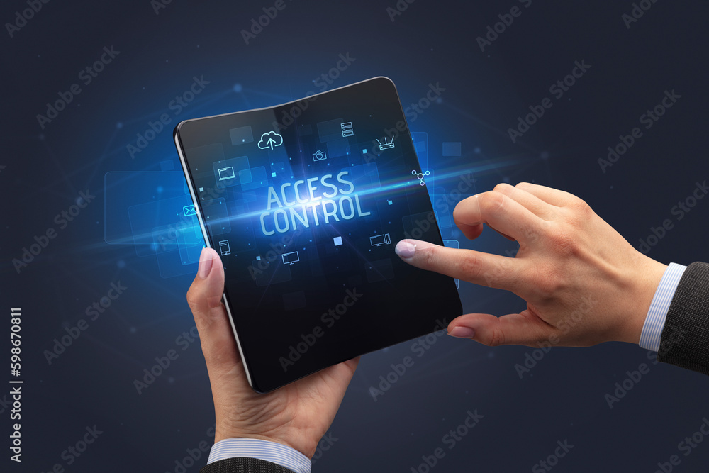 Businessman holding a foldable smartphone, security concept Businessman holding a foldable smartphone, security concept
