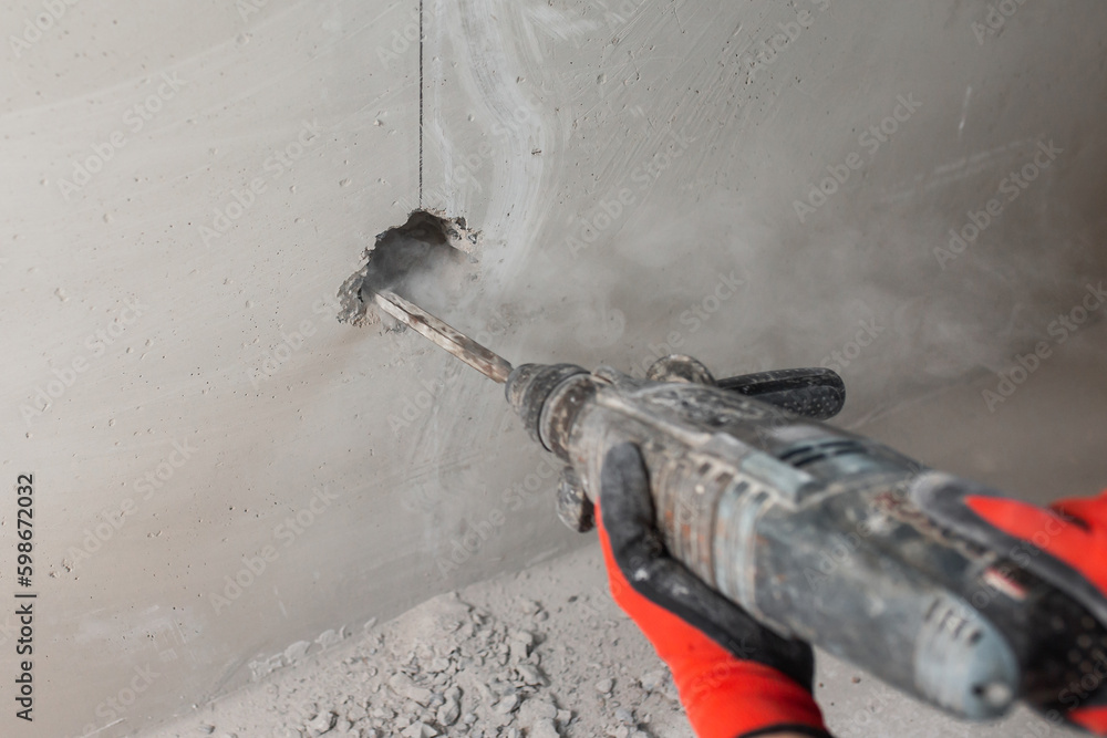 Installation of electrical outlets in a concrete wall hidden electrical wiring at house