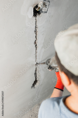 Installation of electrical outlets in a concrete wall - hidden electrical wiring at a house construction site