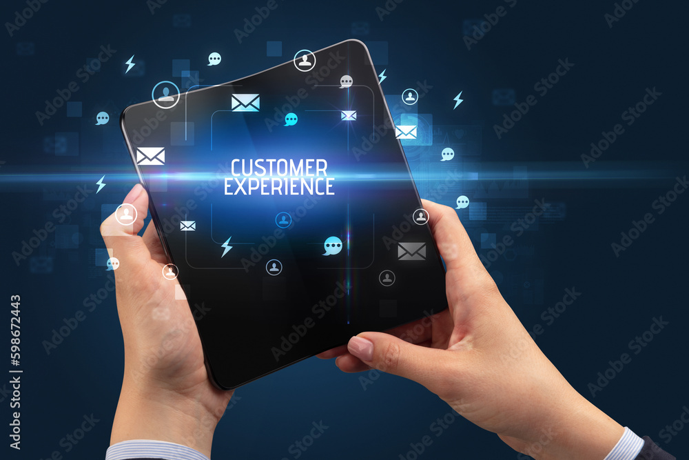 Businessman holding a foldable smartphone, social media concept Businessman holding a foldable smartphone, social media concept