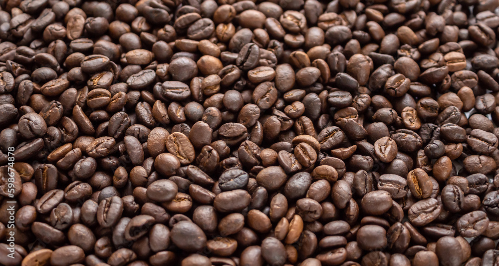 Fresh roasted brown coffee beans background Fresh roasted brown coffee beans background
