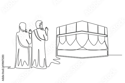 Continuous one line drawing muslim couples wife and husband wearing white traditional clothes pray on kaabah. Hajj and umrah concept. Single line draw design vector graphic illustration.