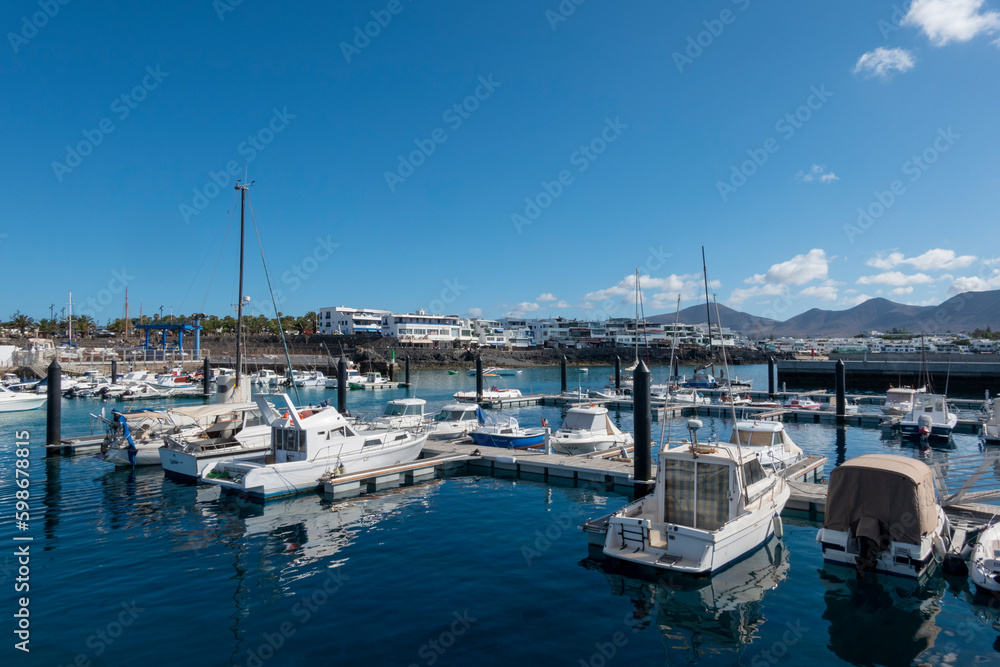 Panoramic view of the pretty port of Playa Blanca, in Yaiza, Lanzarote island, Spain.