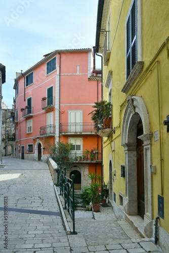 A narrow street among the old houses of Guardia Sanframondi, a small town of Benevento province, Italy. photo