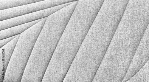 close up view of light grey cotton woven sofa cushion fabric texture background. natural leaf pattern of sofa upholstery used as background. abstract template.