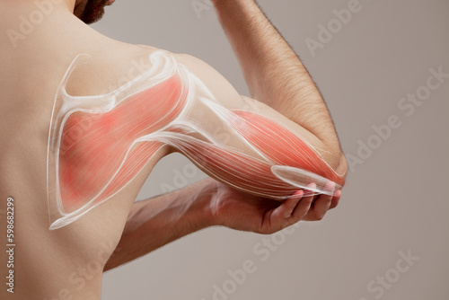 A Man's Grip on His Painful Elbow, human arm pain photo