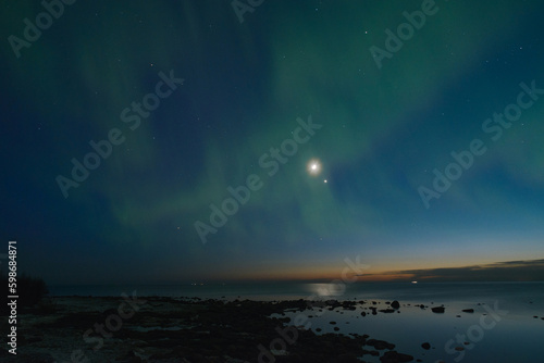 aurora borealis in the starry sky over the sea