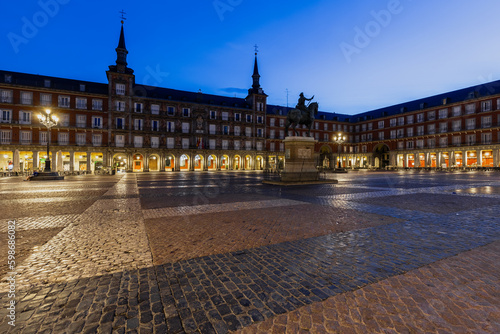 Madrid, Spain 08-06-2021 the beautiful and vibrant plaza mayor in the heart of Madrid during blue hour. The place where you can experience the real Spanish culture and to enjoy a typical bocadillo