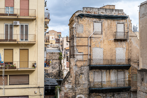 Contrast street view, old versus new buildings in historic quarter of Palermo, Sicily, Italy photo