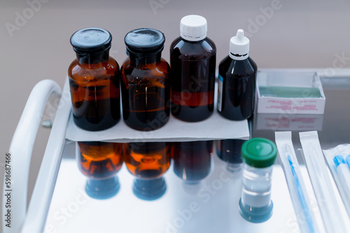 gynecological office in the clinic liquid in glass jars for processing instruments gynecological mirror