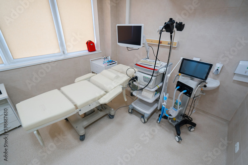 Medical equipment for gastroscopy in the office of the clinic a couch for patients and a gastroscopy with a monitor