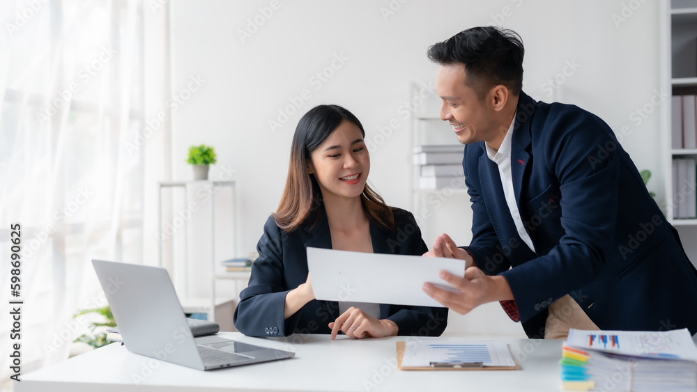 Two asian business people discuss with new startup project Idea presentation, analyze planning at office. Two asian business people discuss with new startup project Idea presentation, analyze planning at office.