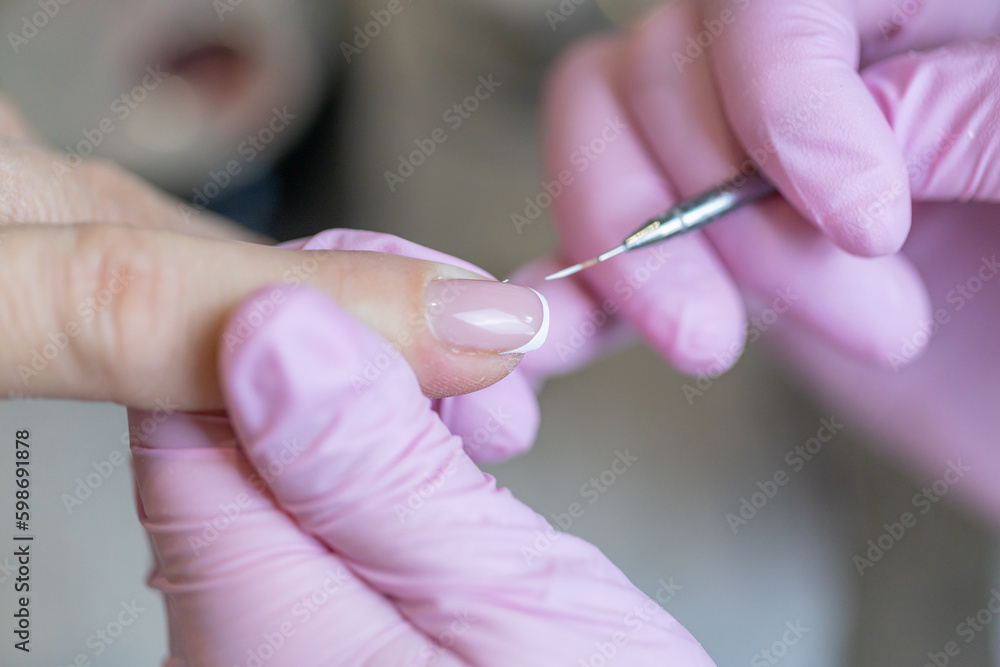 Nails manicure detail with file or brush item. Woman beautiful nail care process. Nails manicure detail with file or brush item. Woman beautiful nail care process.