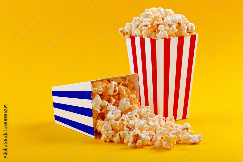 Glass with popcorn on a yellow background Glass with popcorn on a yellow background