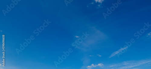 The blue sky with light clouds. Wide photo. © alinamd