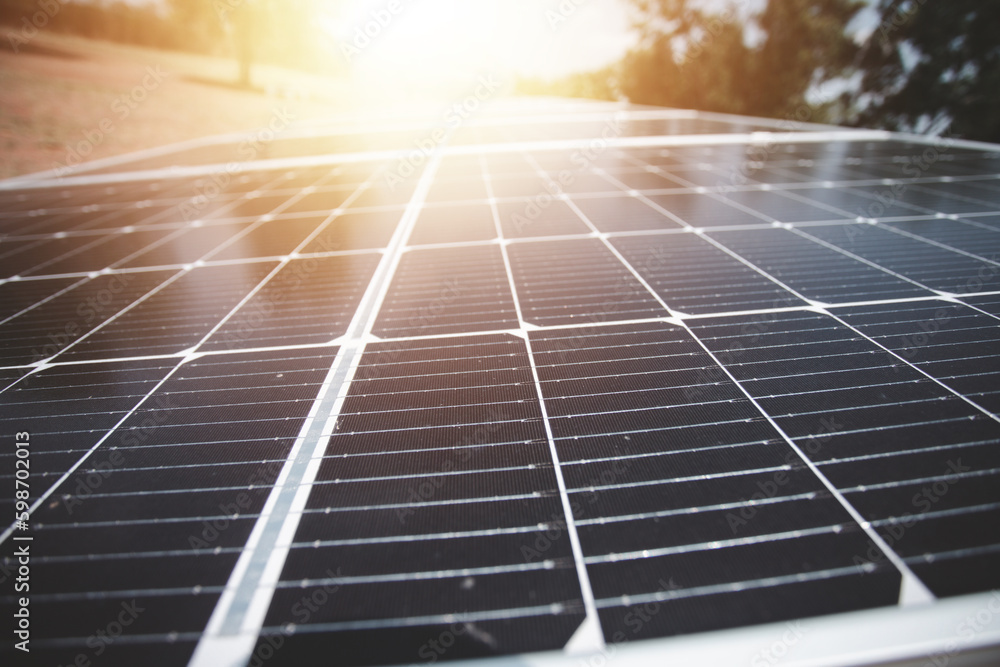 Energy saving solar photovoltaic panels on evening sky background, renewable energy concept.
Energy saving solar photovoltaic panels on evening sky background, renewable energy concept.