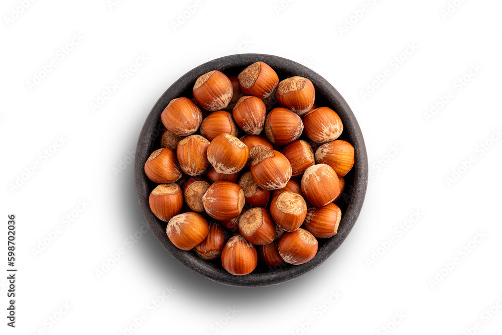 In shell hazelnuts bowl. Up view studio shoot isolated on white background. In shell hazelnuts bowl. Up view studio shoot isolated on white background.