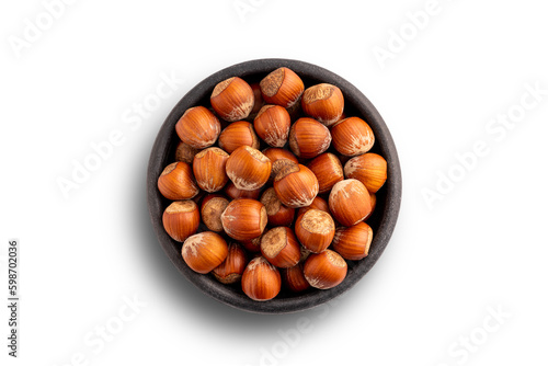 In shell hazelnuts bowl. Up view studio shoot isolated on white background.