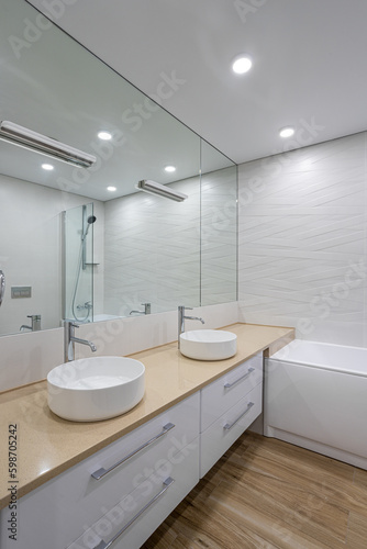 white marble bathtub  sink and mirror