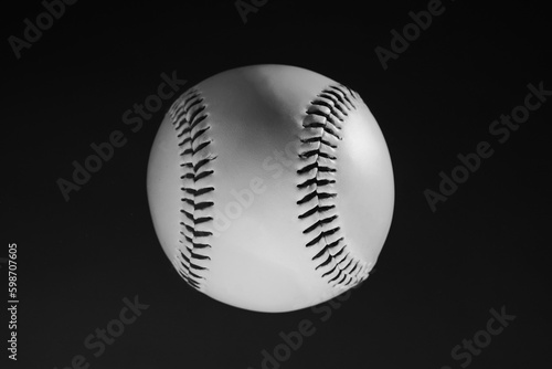 Baseball sports ball in dark black background closeup for new game ball in sport.
