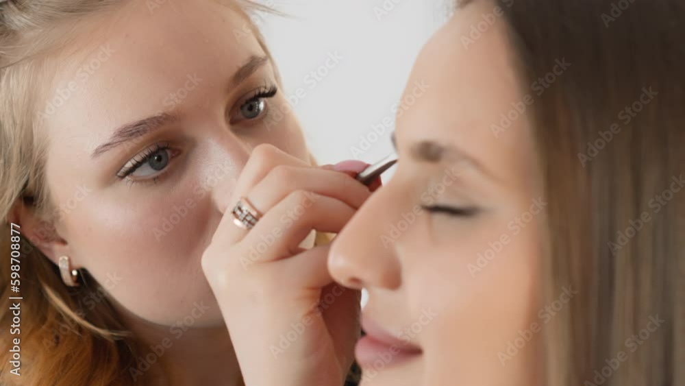 The client enjoys peace and relaxation during the eyebrow care procedure at the cosmetologist. Perfectly made eyebrows create a confident look and emphasize the natural beauty of the Generative AI The client enjoys peace and relaxation during the eyebrow care procedure at the cosmetologist. Perfectly made eyebrows create a confident look and emphasize the natural beauty of the Generative AI