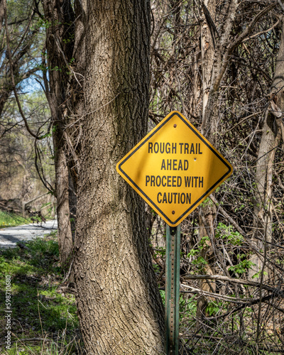 rough trail ahead, proceed with caution - warning sign on Steamboat Trace Trail converted from old railroad near Peru, Nebraska